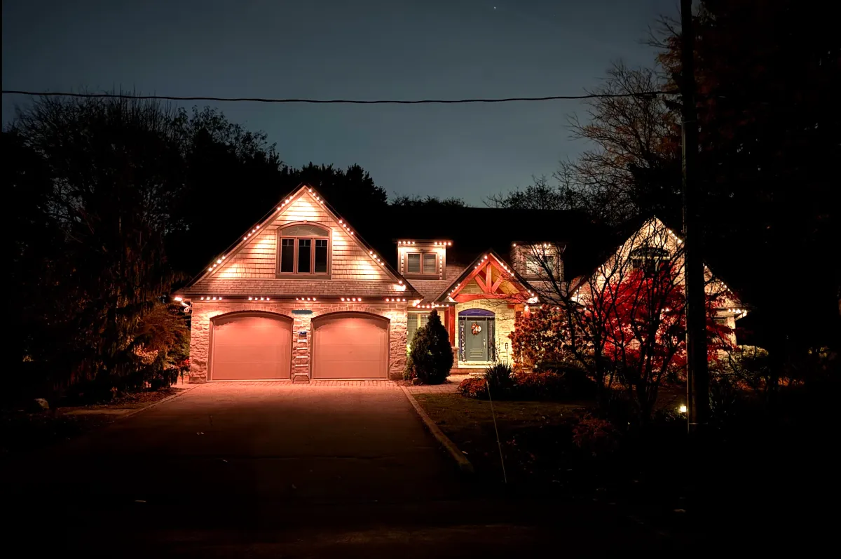 Permanent LED lights installed on a home roofline
